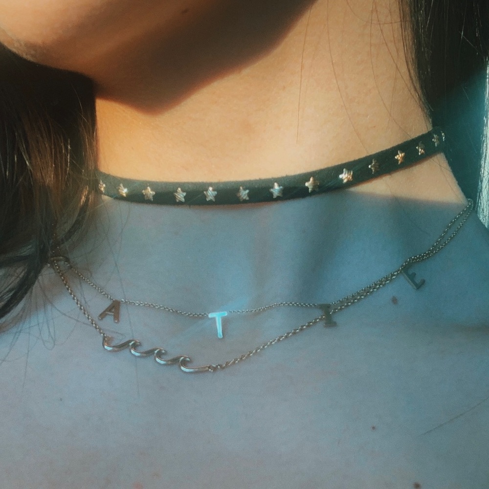 Black velvet choker with gold stars.